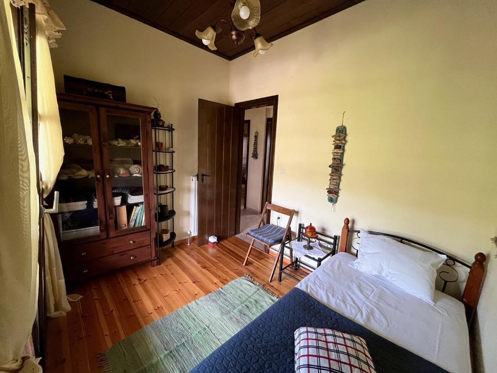 Postel nebo postele na pokoji v ubytování Stone Villa Rokosini