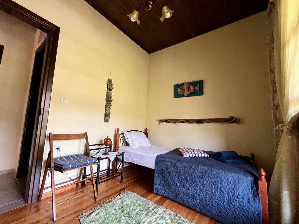 Postel nebo postele na pokoji v ubytování Stone Villa Rokosini