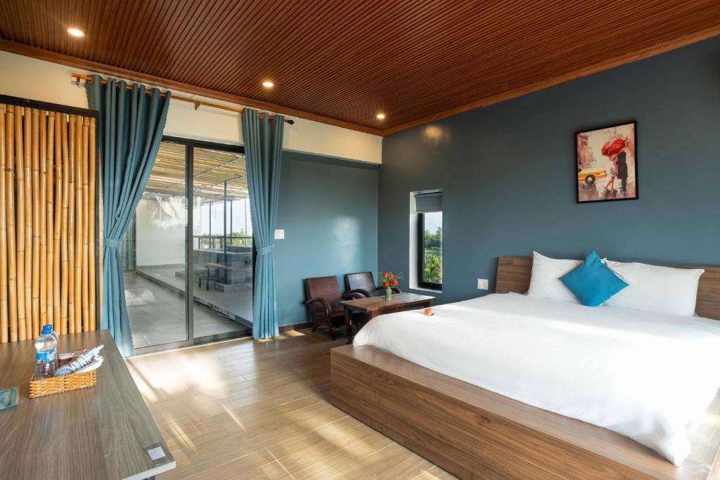 Postel nebo postele na pokoji v ubytování Phúc Villa Hoi An