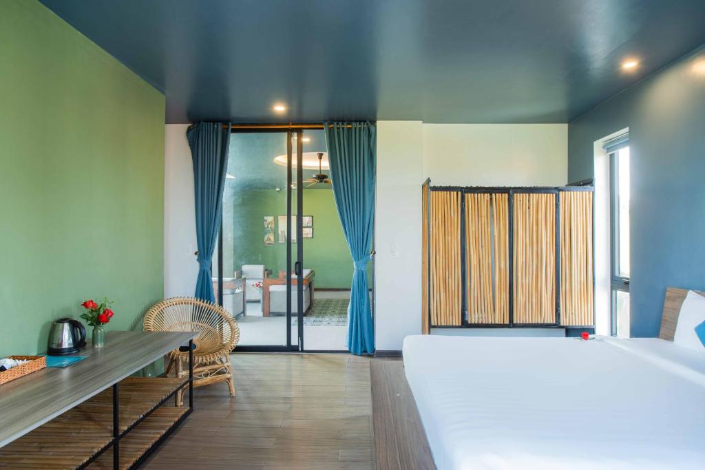 Postel nebo postele na pokoji v ubytování Phúc Villa Hoi An
