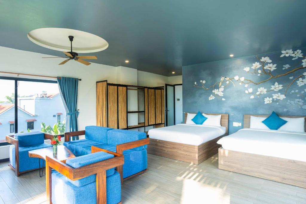Postel nebo postele na pokoji v ubytování Phúc Villa Hoi An