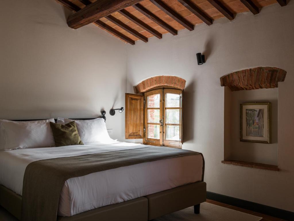 Postel nebo postele na pokoji v ubytování Borgo San Vincenzo