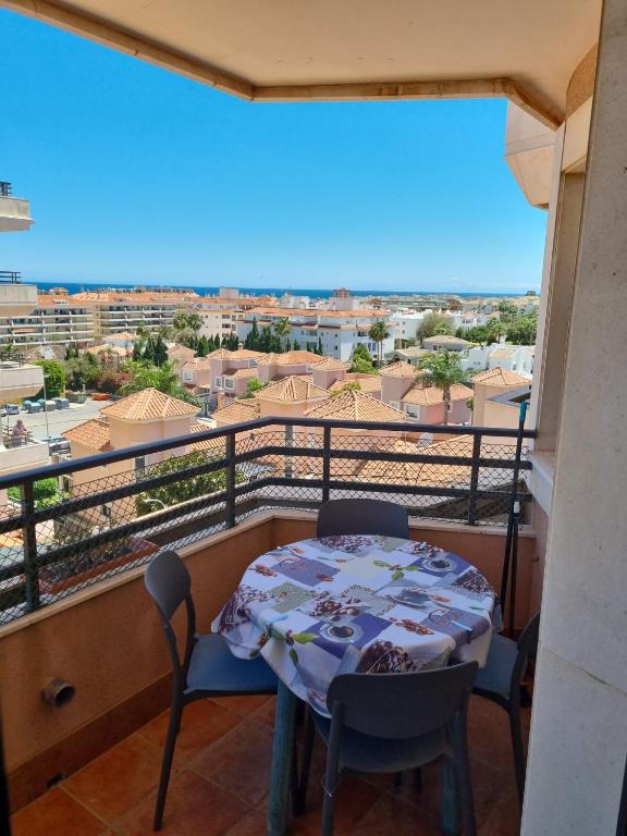 a balcony with a table and chairs and a view at Place-To-Relax in San Luis de Sabinillas