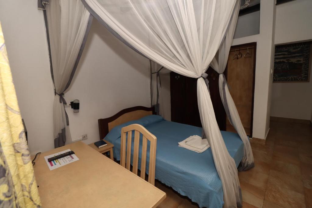 Postel nebo postele na pokoji v ubytování Makuti Villas Resort