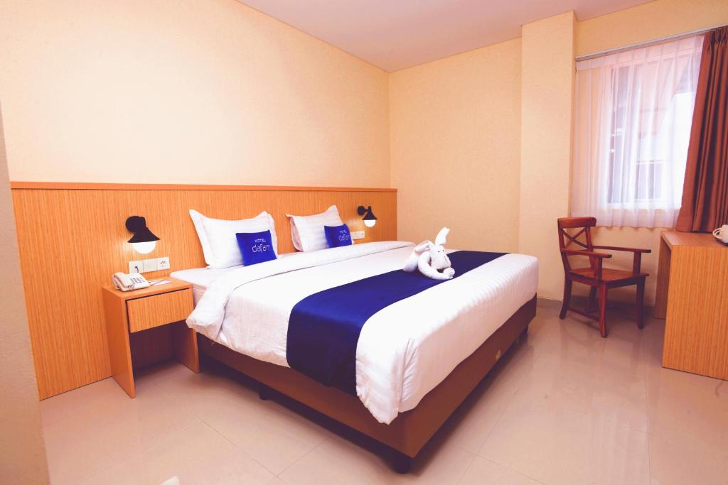 Postel nebo postele na pokoji v ubytování Hotel Dafam Rio
