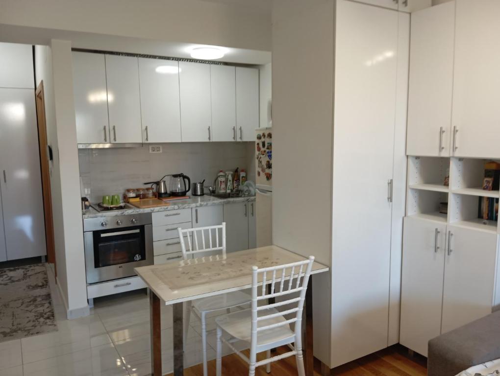 Kuchyň nebo kuchyňský kout v ubytování Maxima Apartment