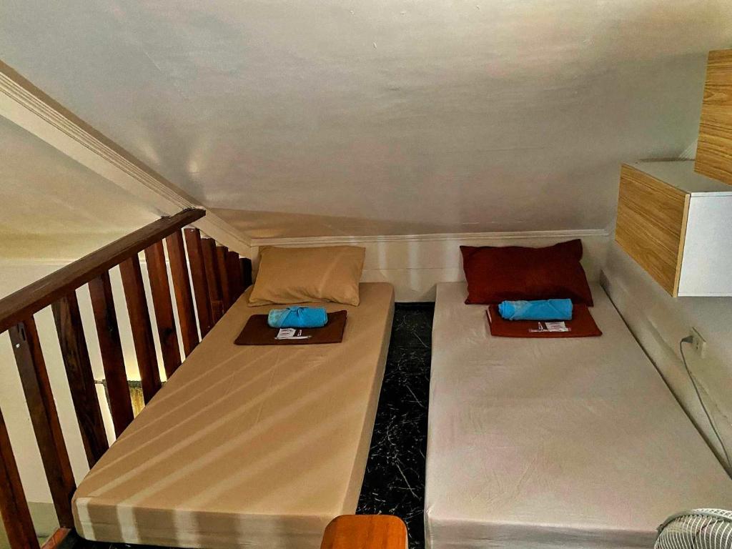 Postel nebo postele na pokoji v ubytování TOBY HOUSE SiARGAO