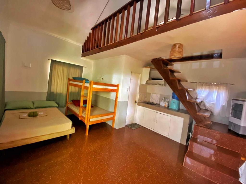Postel nebo postele na pokoji v ubytování TOBY HOUSE SiARGAO