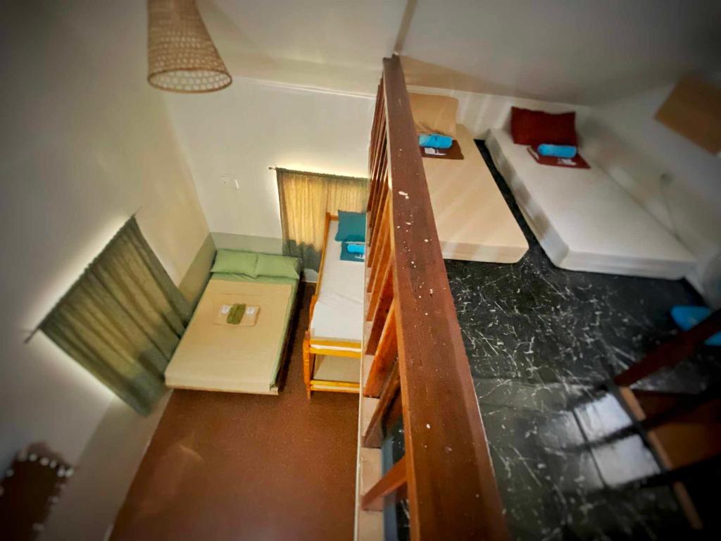 Postel nebo postele na pokoji v ubytování TOBY HOUSE SiARGAO