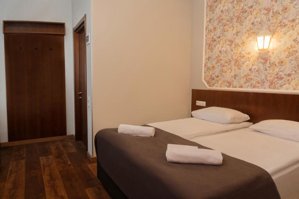 Postel nebo postele na pokoji v ubytování Tea for Two Hotel