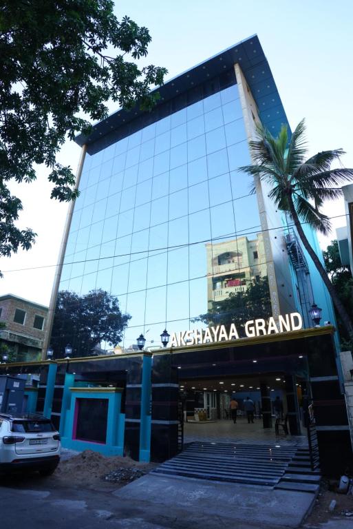 a building with a sign on the front of it at Akshayaa Grand in Visakhapatnam