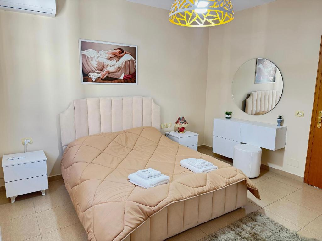 Postel nebo postele na pokoji v ubytování Shkodra Apartment