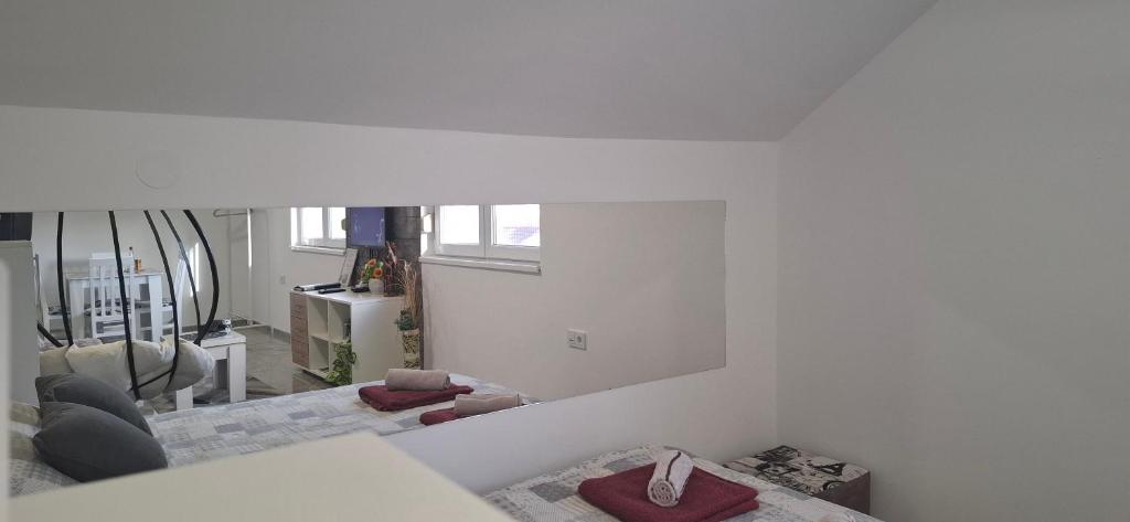 Postel nebo postele na pokoji v ubytování APARTMENTS IVANOViC CENTER CITY