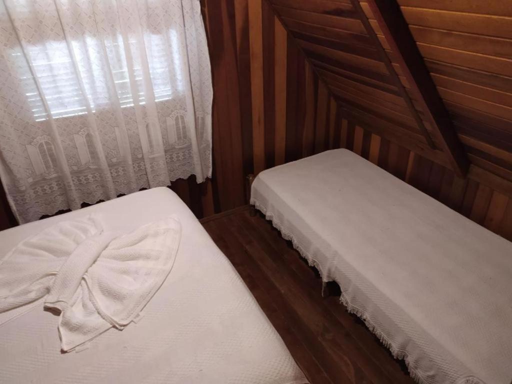 Postel nebo postele na pokoji v ubytování Chalé Represa Varanda do Sol Joanópolis