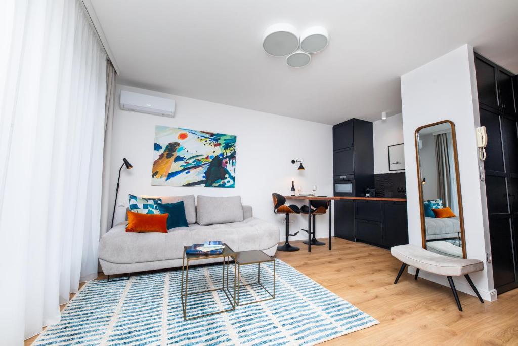 a living room with a couch and a table at City Sky Lodge in Budapest
