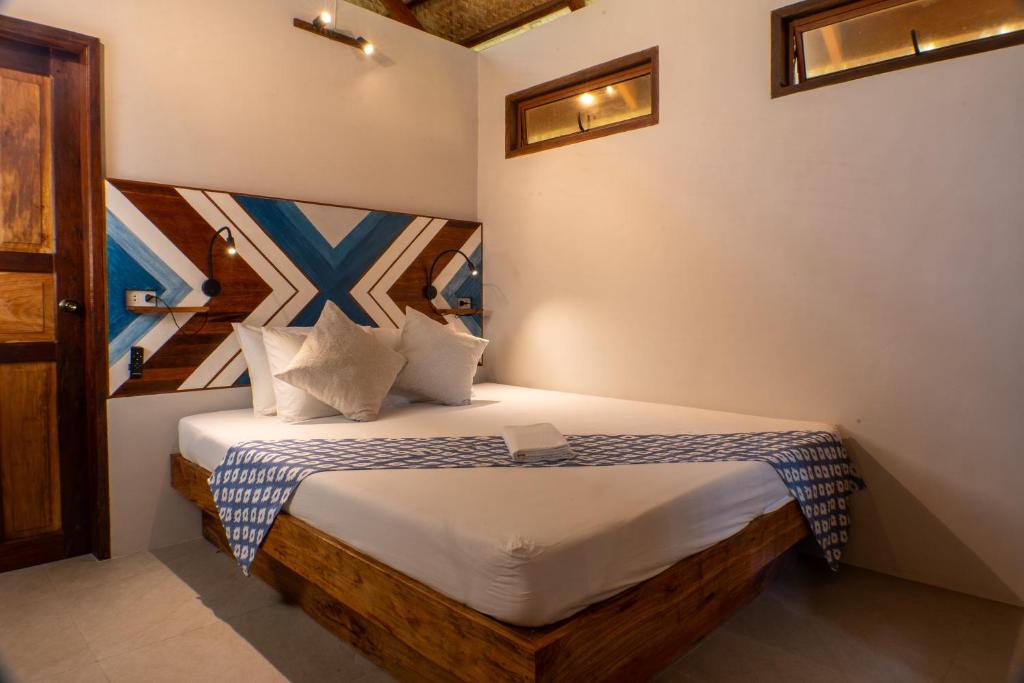 Postel nebo postele na pokoji v ubytování Private Beachfront El Nido - Sa Dulo Villa Diapila Bay