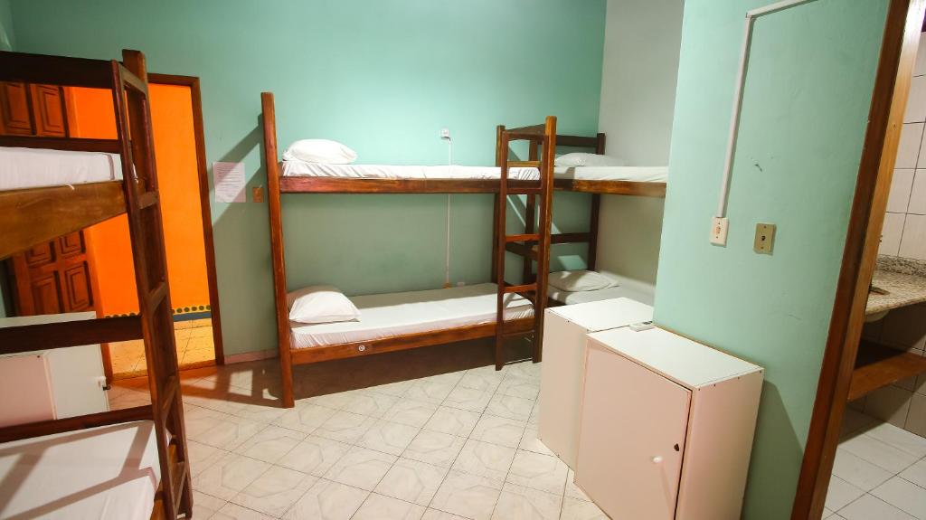 Postel nebo postele na pokoji v ubytování Sky Suites Pousada