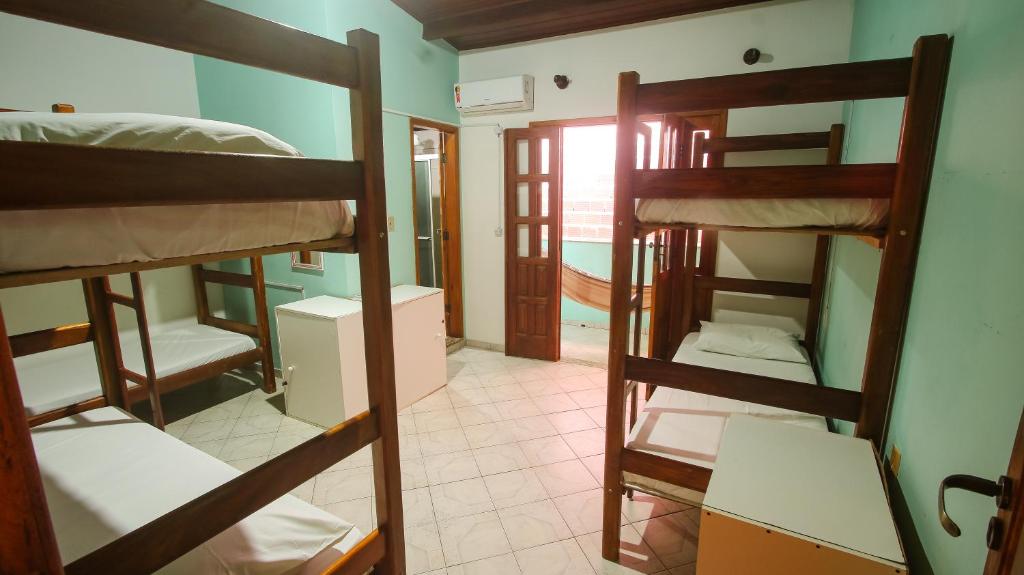 Postel nebo postele na pokoji v ubytování Sky Suites Pousada