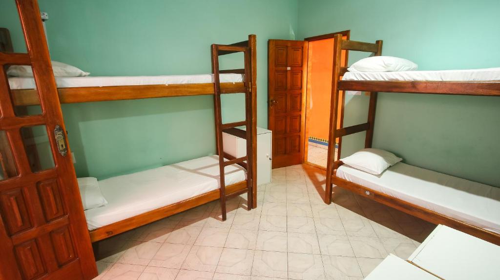Postel nebo postele na pokoji v ubytování Sky Suites Pousada
