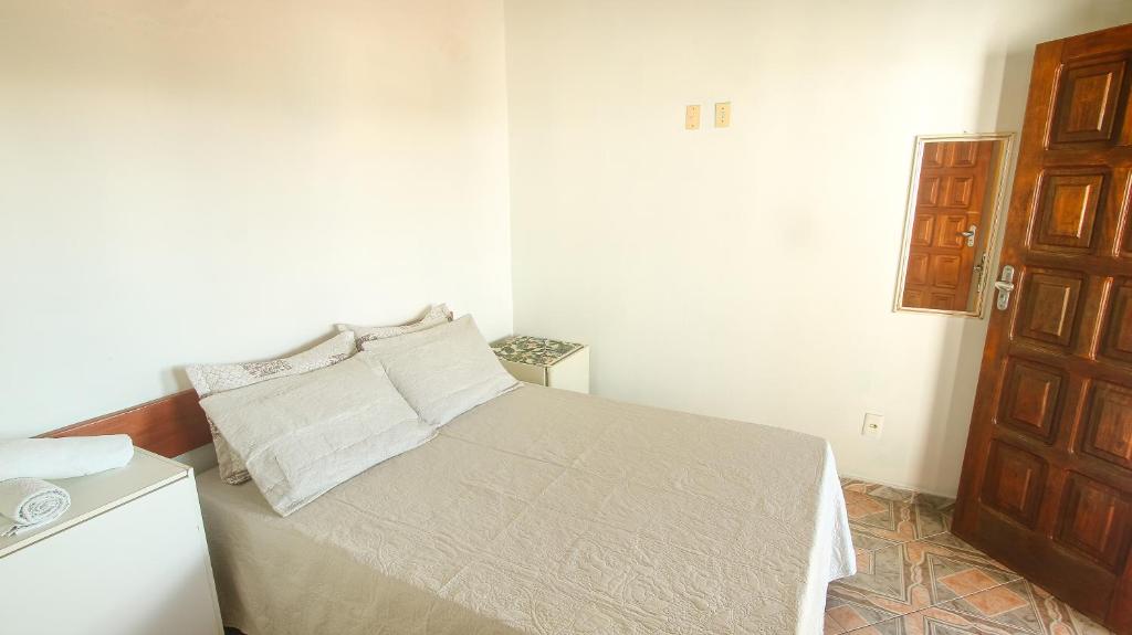 Postel nebo postele na pokoji v ubytování Sky Suites Pousada