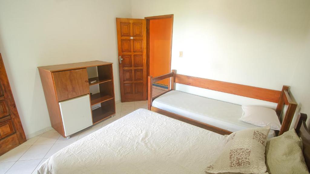 Postel nebo postele na pokoji v ubytování Sky Suites Pousada