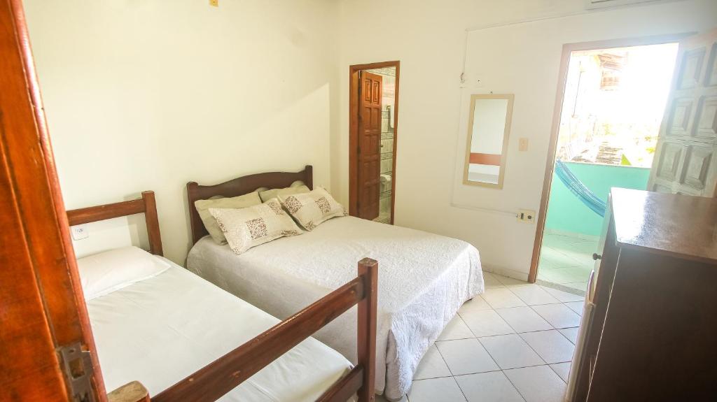 Postel nebo postele na pokoji v ubytování Sky Suites Pousada