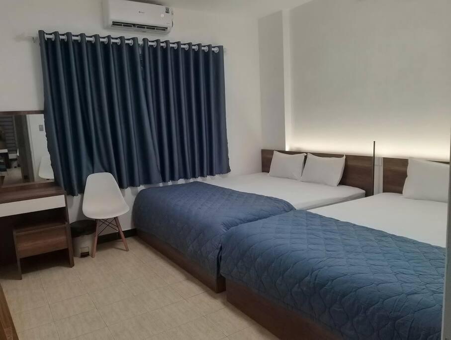 Postel nebo postele na pokoji v ubytování T-House 304