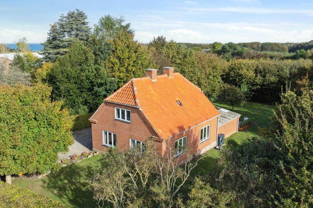 an aerial view of a house with an orange roof at Renovated Home In Rural Idyll, Close To The Beach in Haderslev