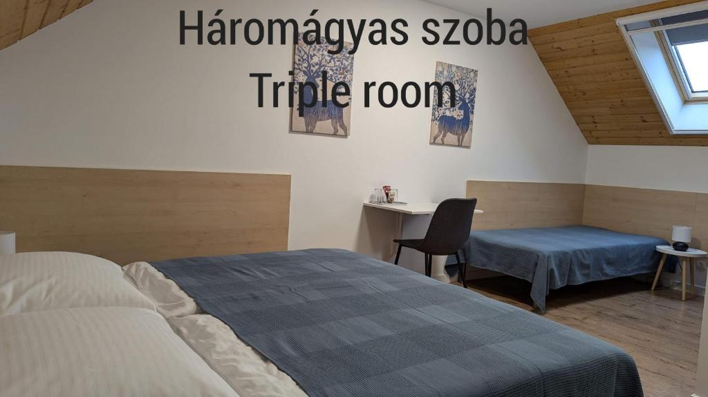 Postel nebo postele na pokoji v ubytování ZánKapu Szálláshely