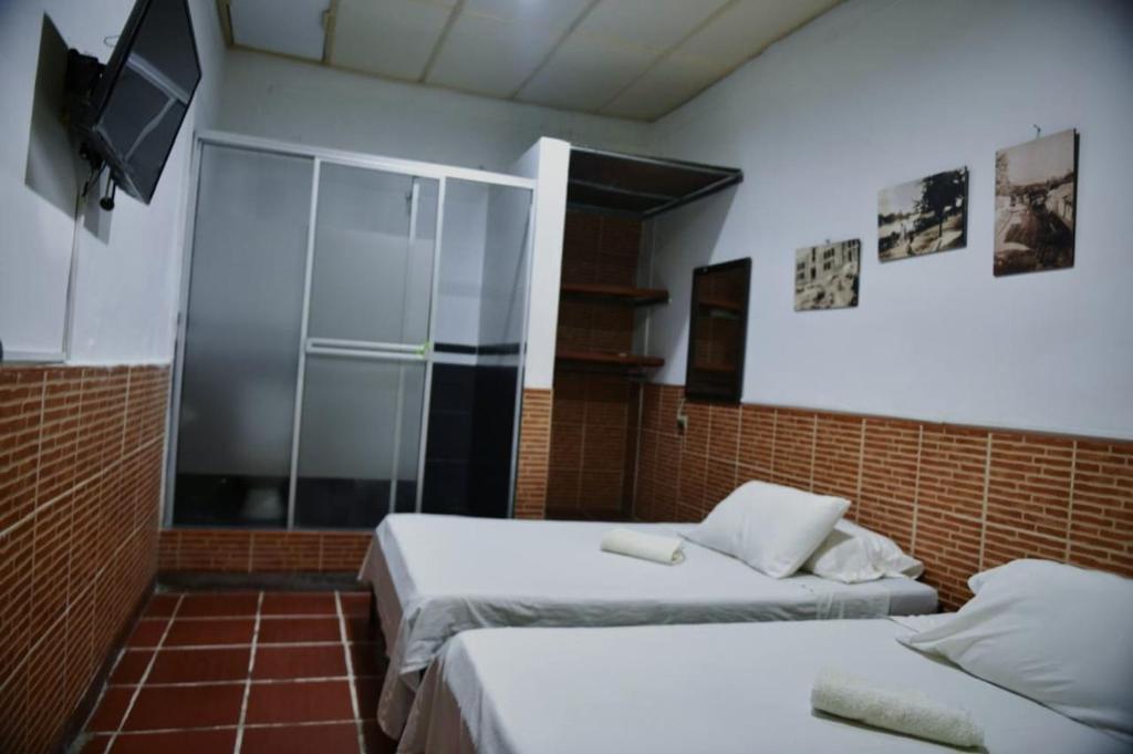 Postel nebo postele na pokoji v ubytování Hotel Kamellon