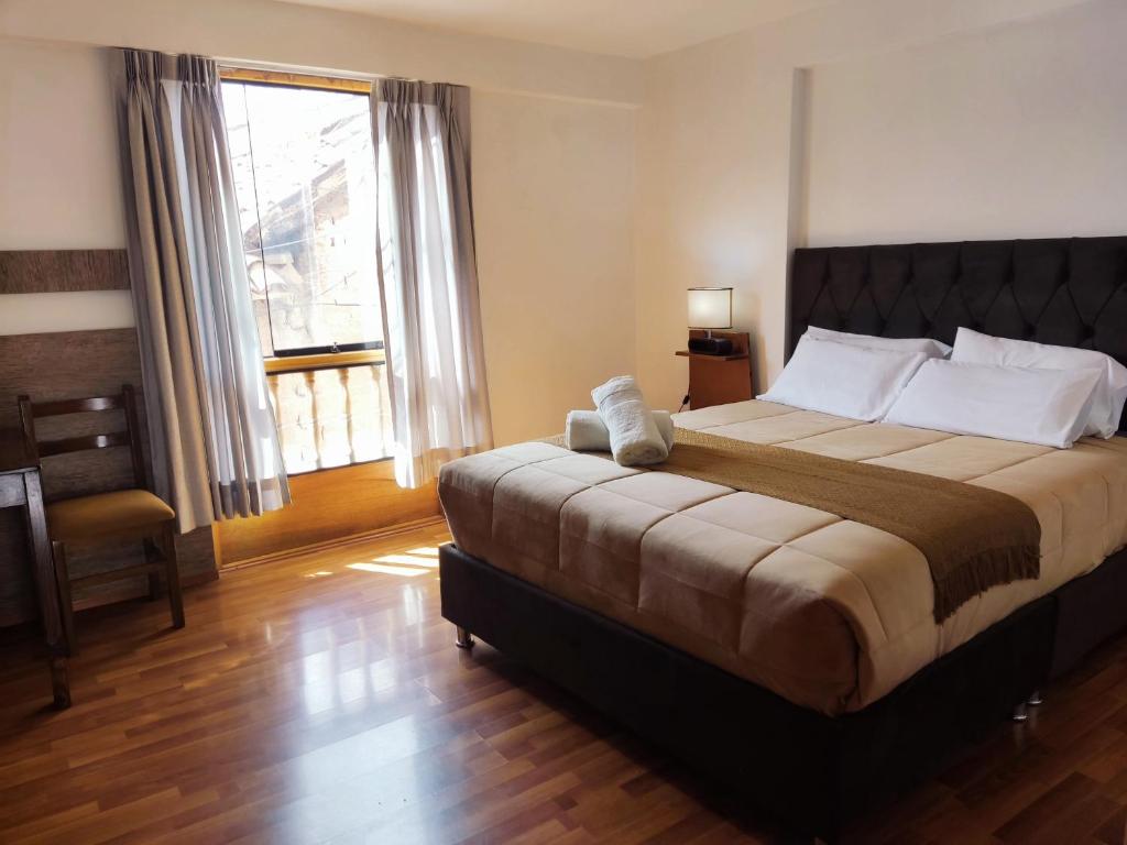 Ένα ή περισσότερα κρεβάτια σε δωμάτιο στο Anata Hotel