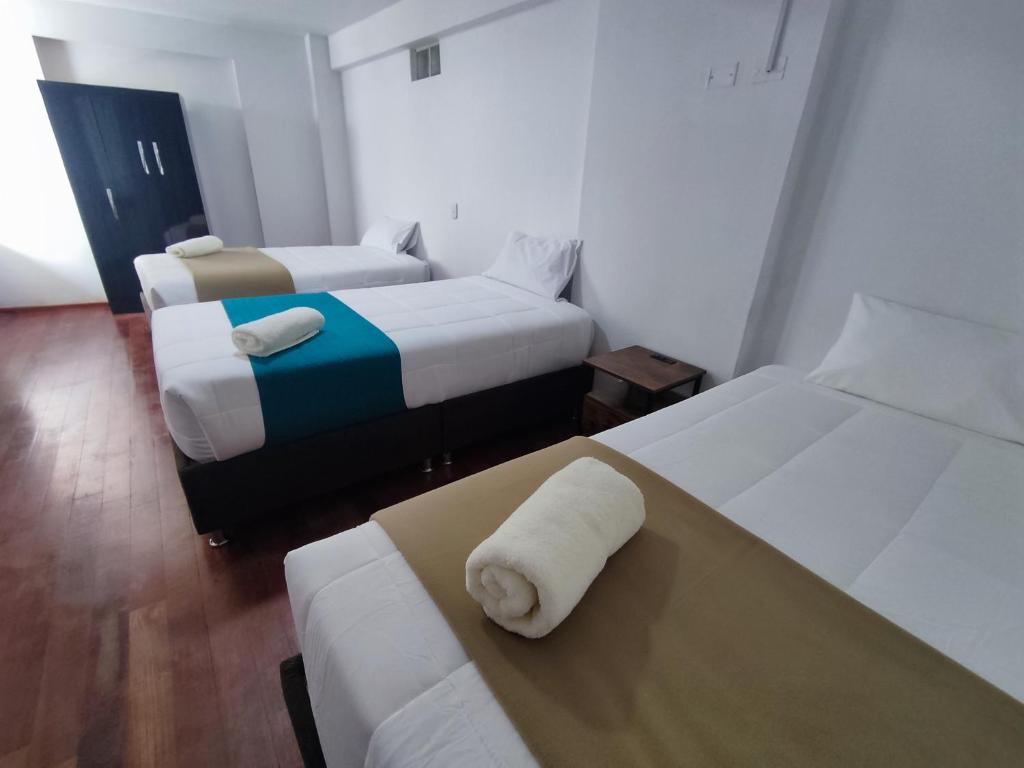Ένα ή περισσότερα κρεβάτια σε δωμάτιο στο Anata Hotel