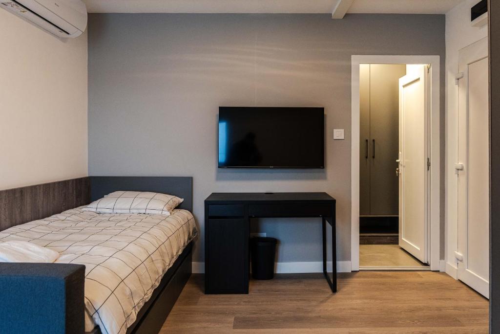 Postel nebo postele na pokoji v ubytování REAL Suites