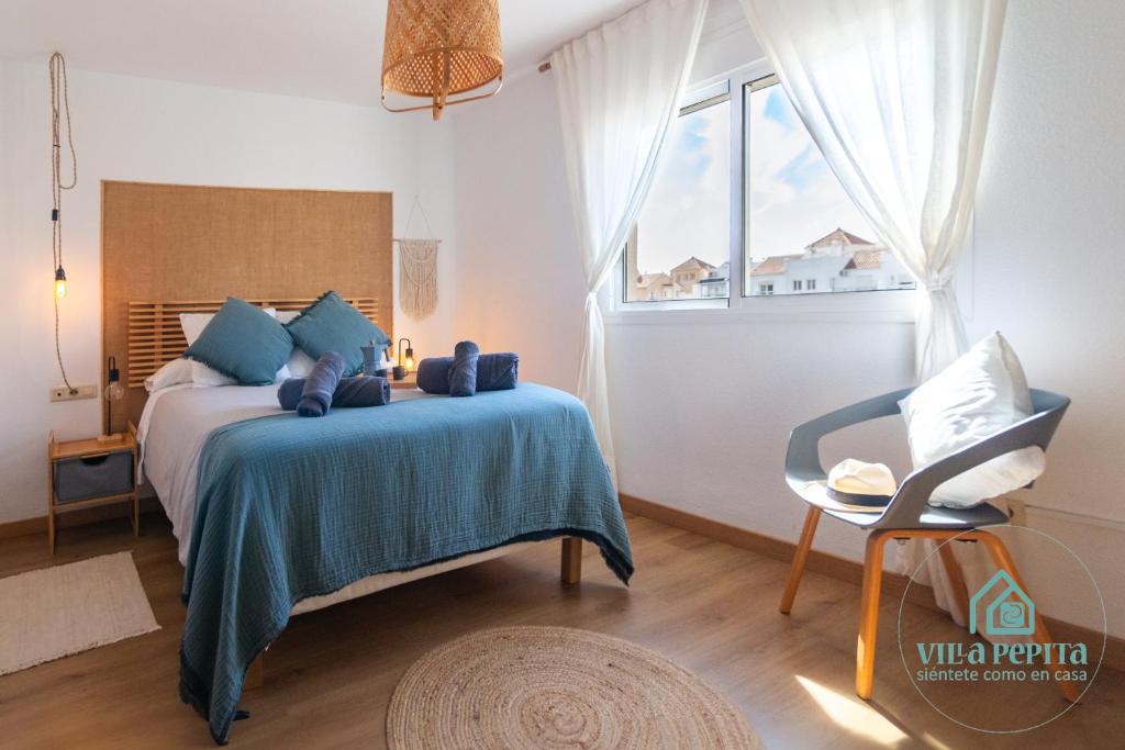 Postel nebo postele na pokoji v ubytování Villa Pepita