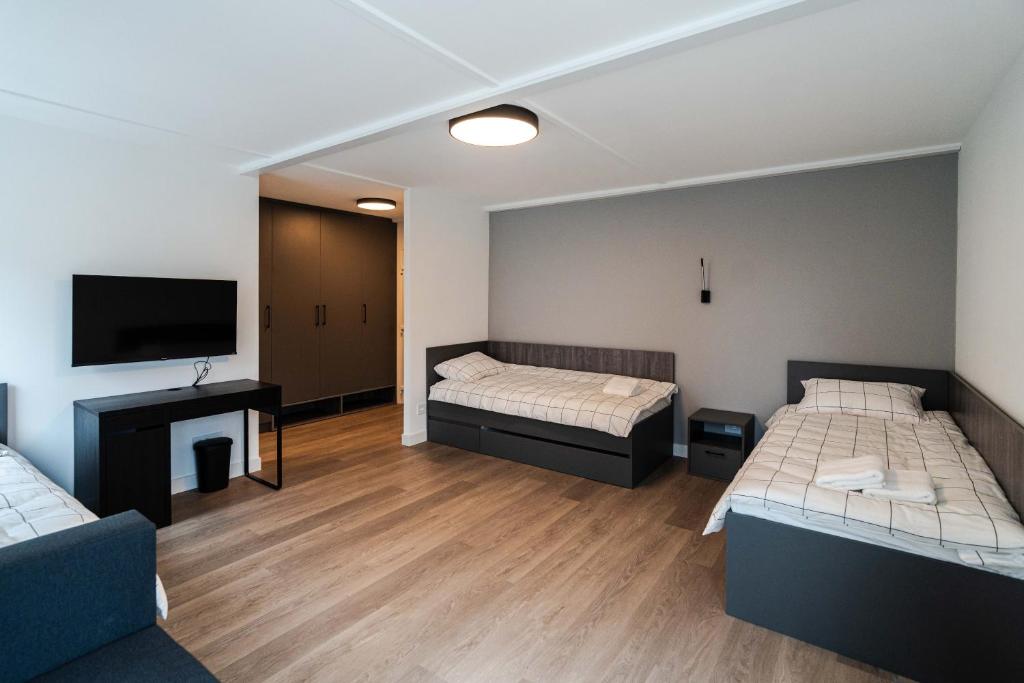 Postel nebo postele na pokoji v ubytování REAL Suites