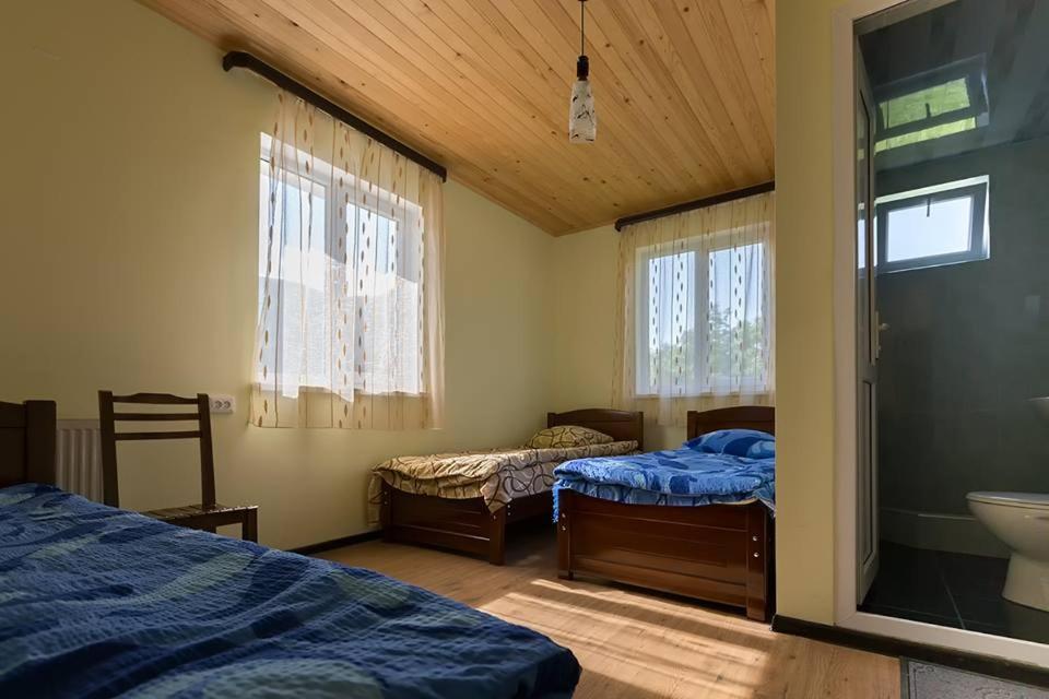 Postel nebo postele na pokoji v ubytování Hotel Nini