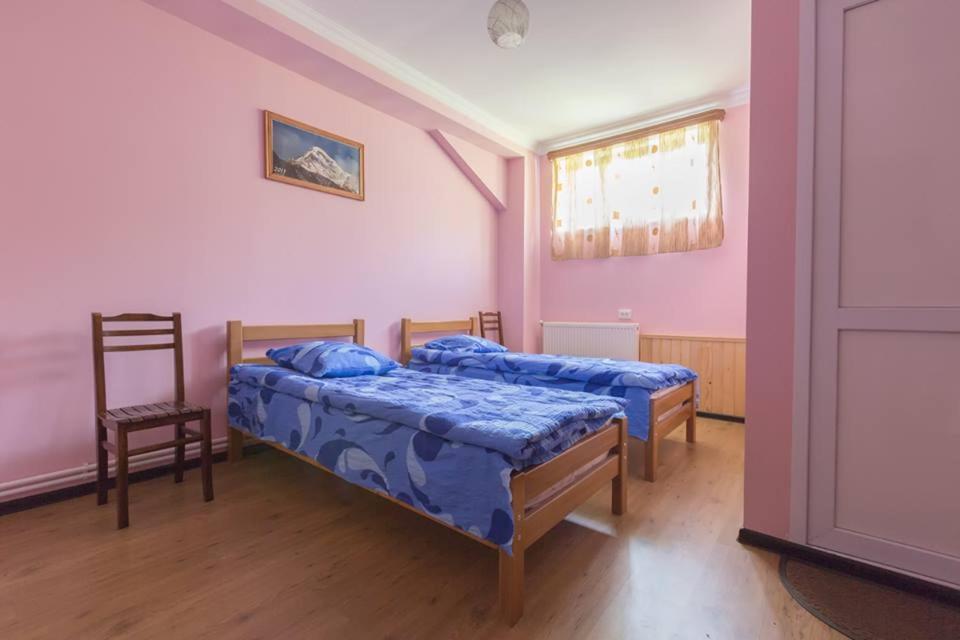 Postel nebo postele na pokoji v ubytování Hotel Nini