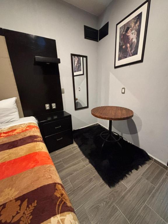 Postel nebo postele na pokoji v ubytování Hotel Real Campestre Tepetoci