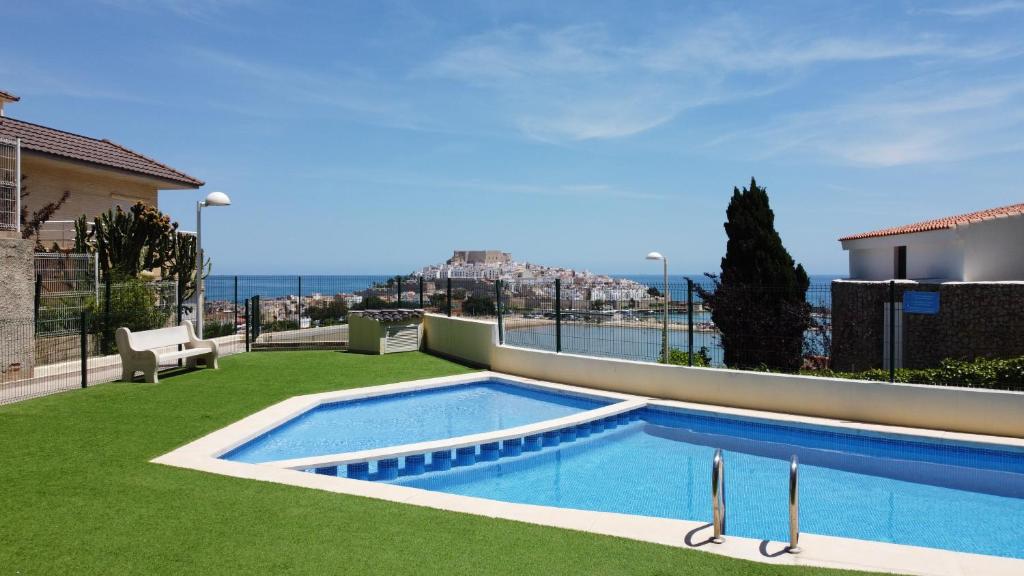 a swimming pool in the yard of a house at Blue Marine in Peniscola