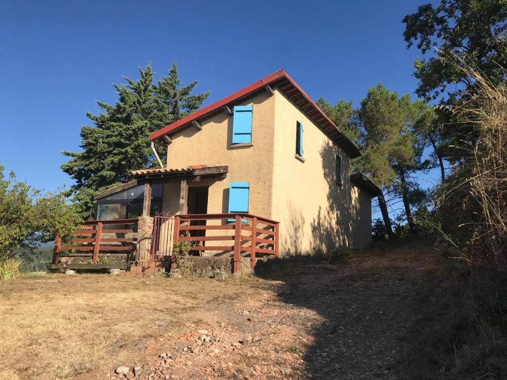 a house on the side of a hill at La Petite Maison sur la Colline in Chassiers