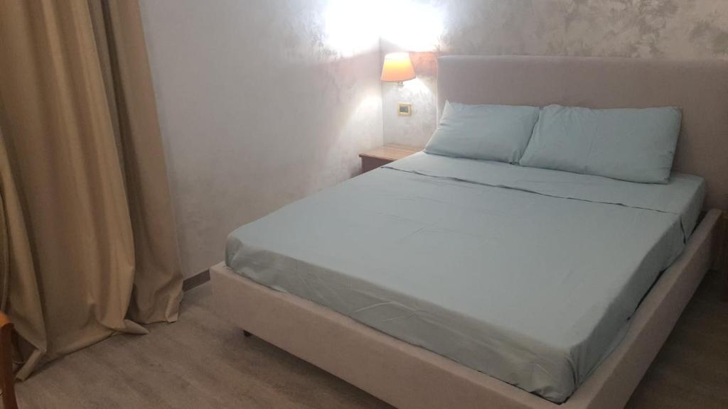Postel nebo postele na pokoji v ubytování Sandel Giubileo Hotel