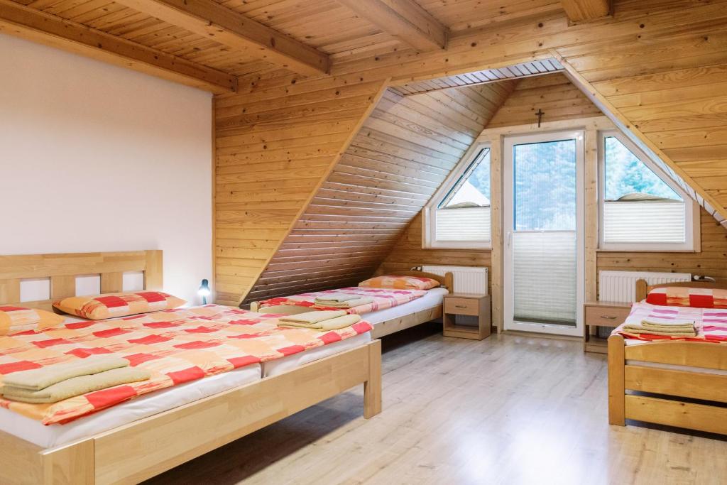 Postel nebo postele na pokoji v ubytování Chalupa Zeleznik