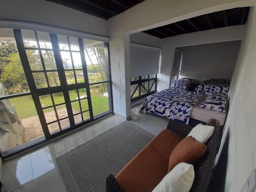 Postel nebo postele na pokoji v ubytování Hotel MACA lago calima