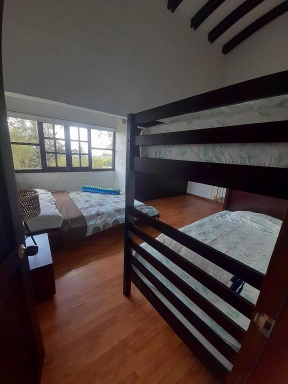 Postel nebo postele na pokoji v ubytování Hotel MACA lago calima
