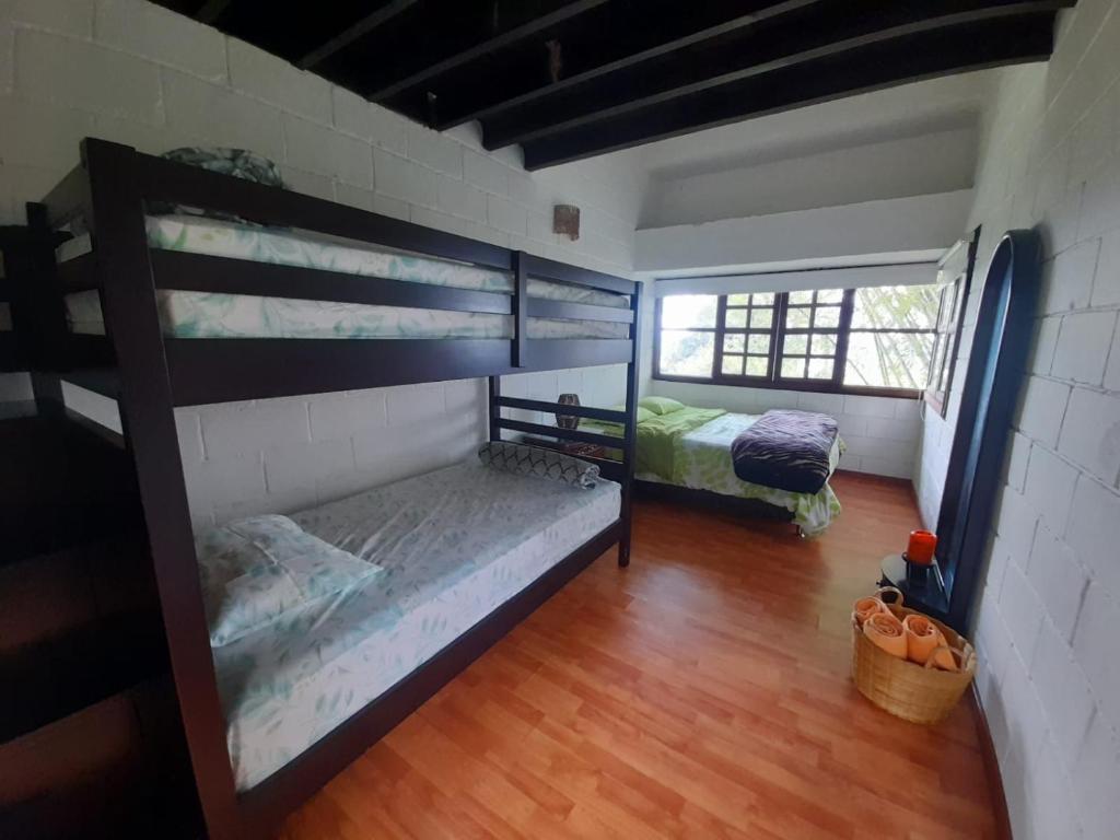 Postel nebo postele na pokoji v ubytování Hotel MACA lago calima