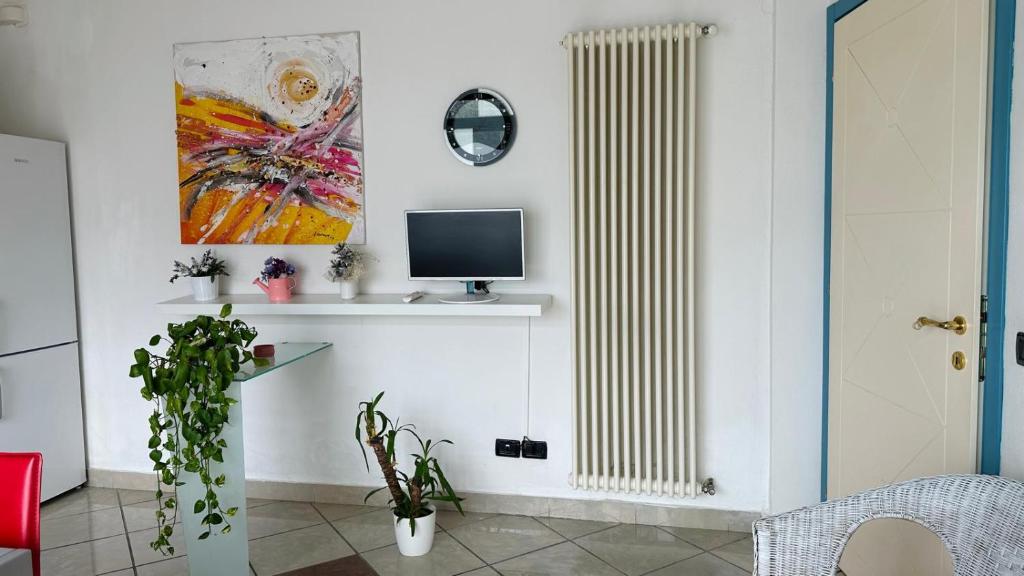 Televízia a/alebo spoločenská miestnosť v ubytovaní Amarin Pisa Apartment