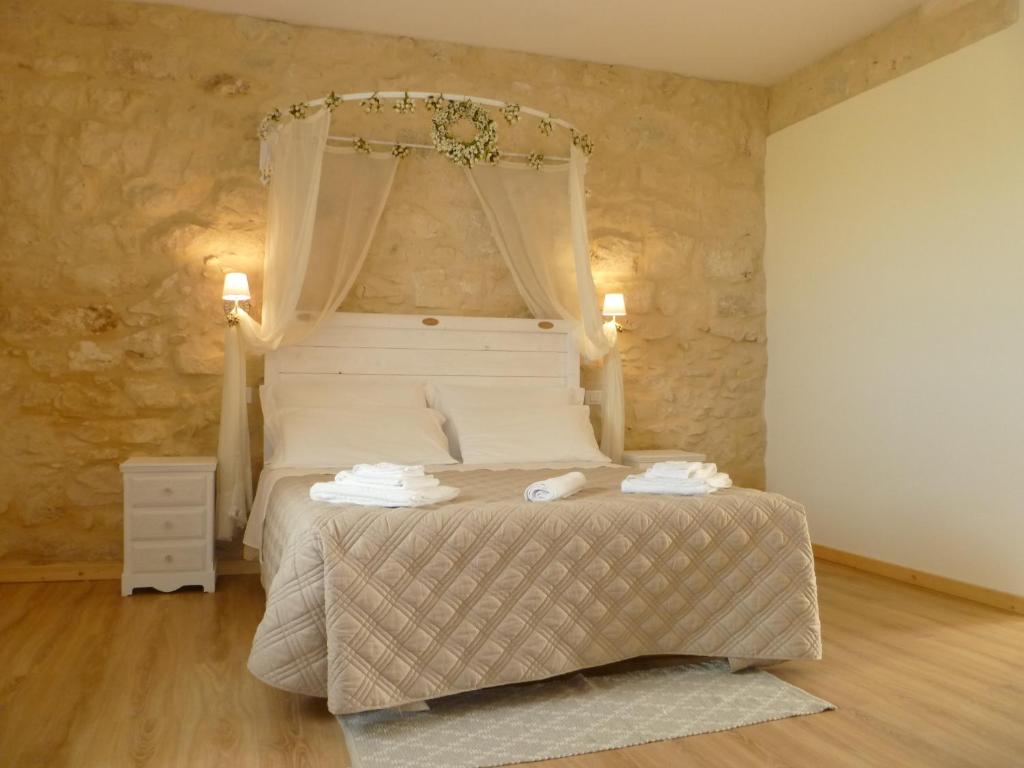 Postel nebo postele na pokoji v ubytování Casale 1821