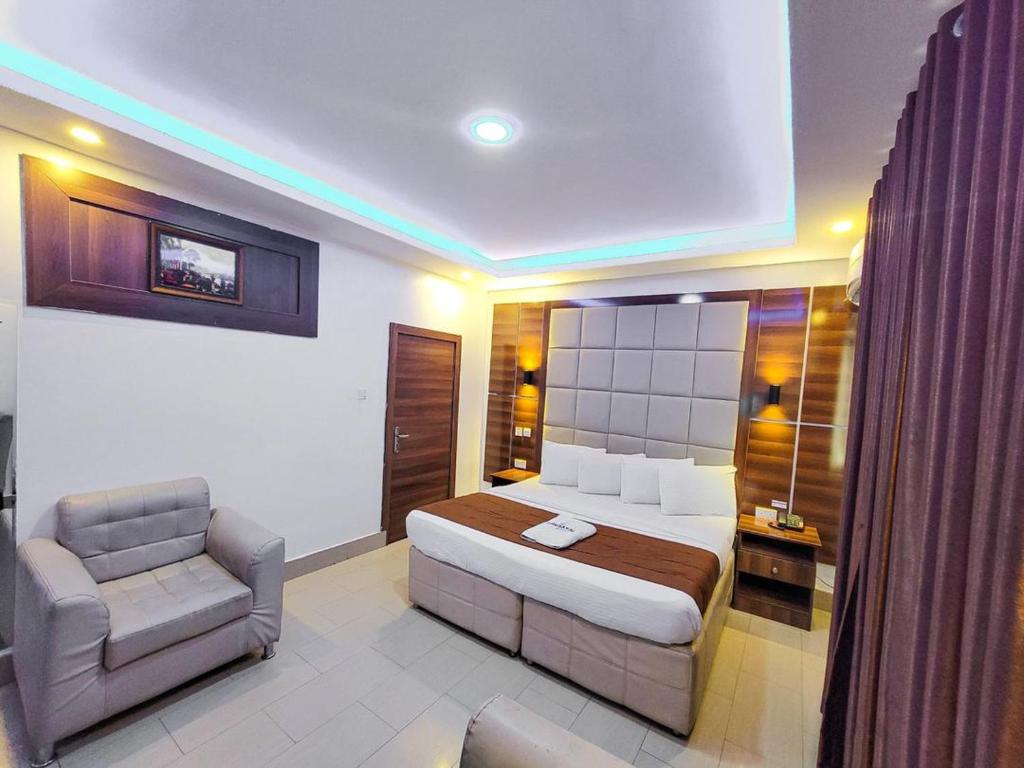 Postel nebo postele na pokoji v ubytování Presken Hotels @ Freedom Way, Lekki