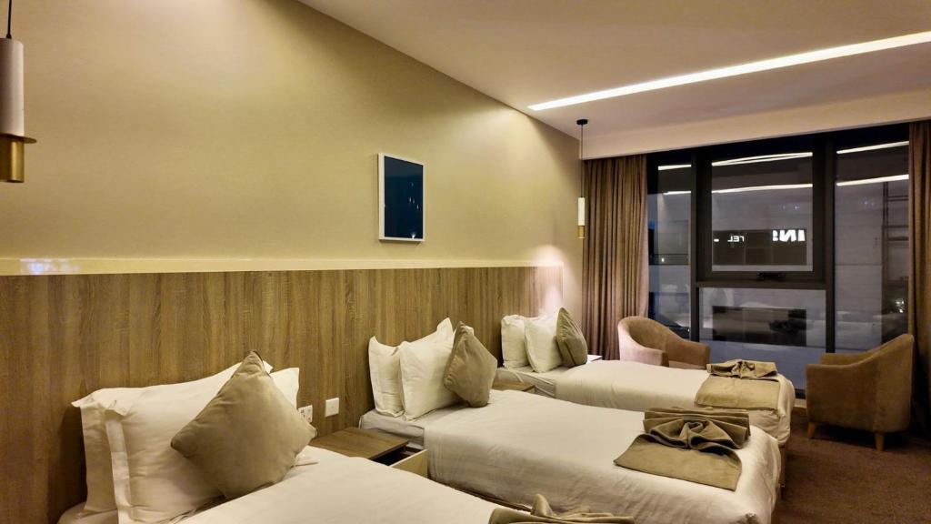 Postel nebo postele na pokoji v ubytování Twins Boutique Hotel