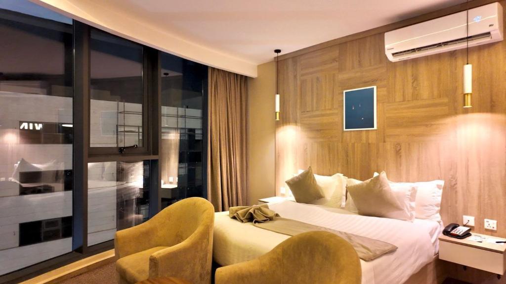 Postel nebo postele na pokoji v ubytování Twins Boutique Hotel